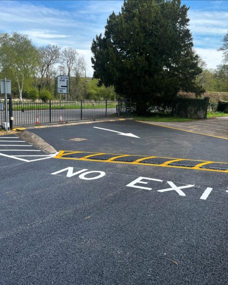 Road area with a 'No Exit' sign and clear directional markings on the pavement.